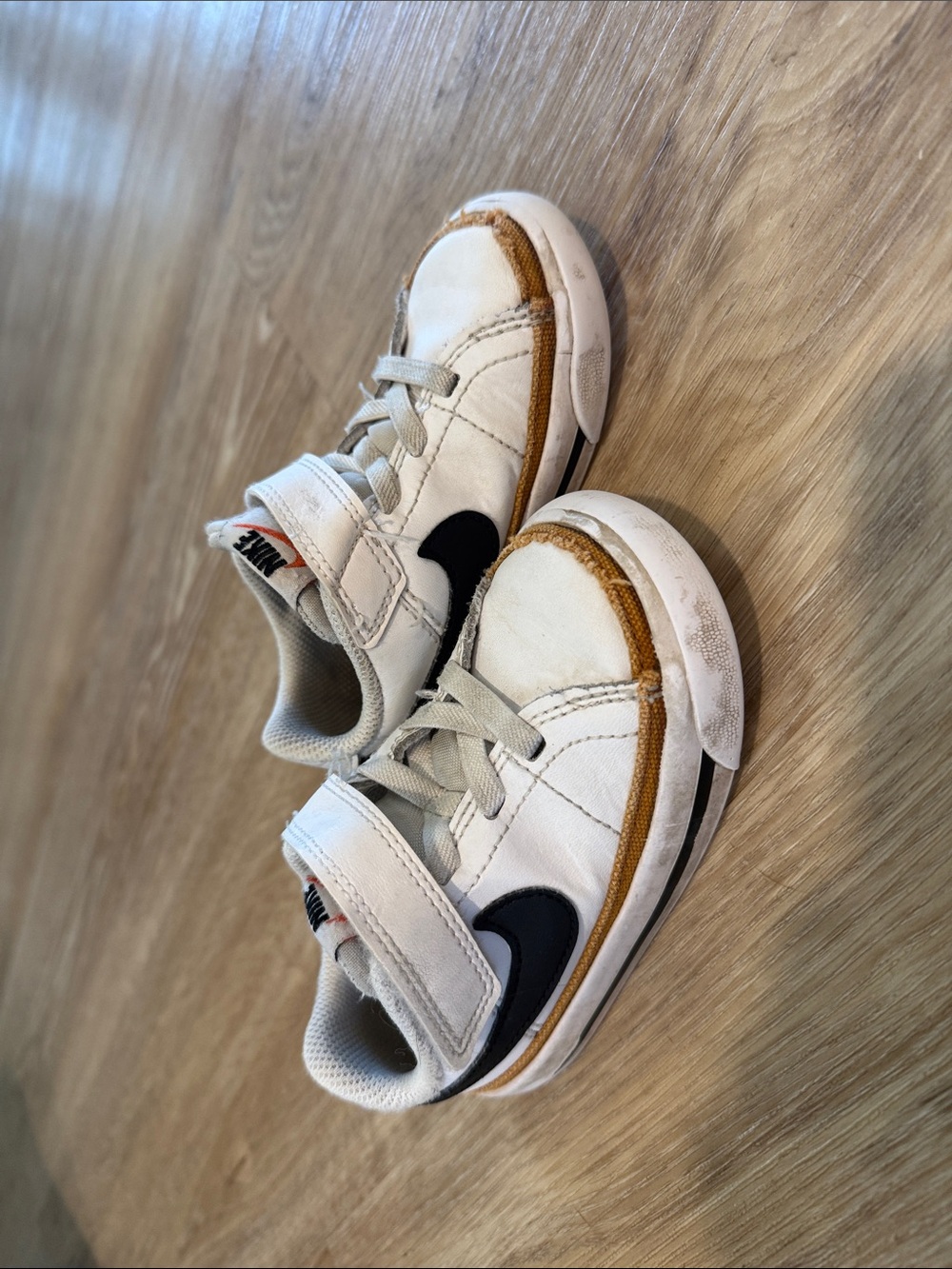 Nike Kids White Sneakers with Black Swoosh and Tan Trim